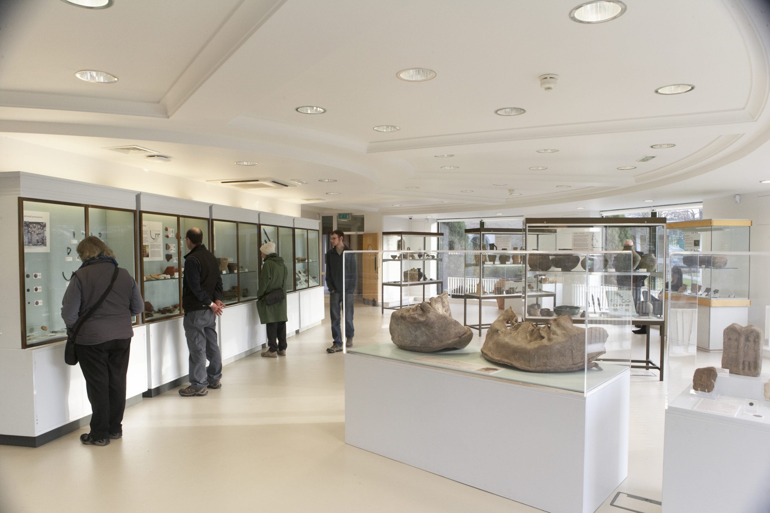 The University of Nottingham Museum with people stood looking at the glass cases