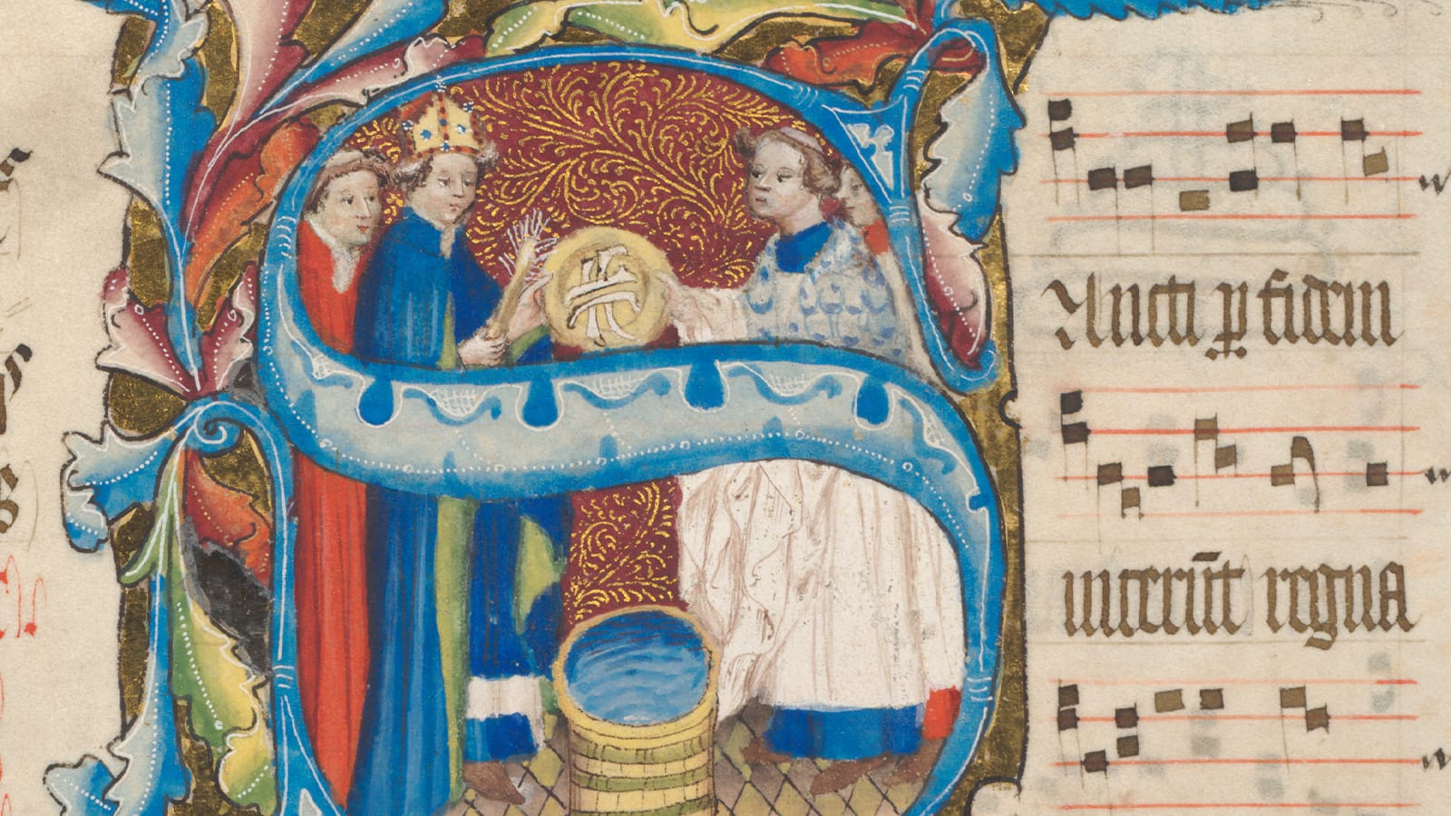 An old manuscript with an elaborately painted S