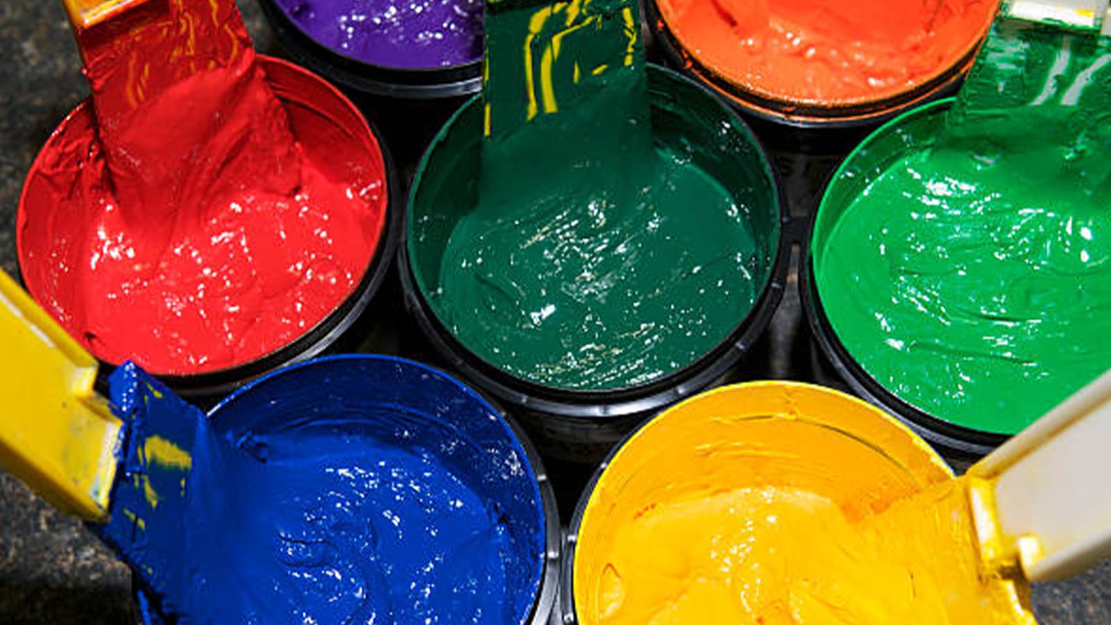 Pots of paint in red, green, blue and yellow