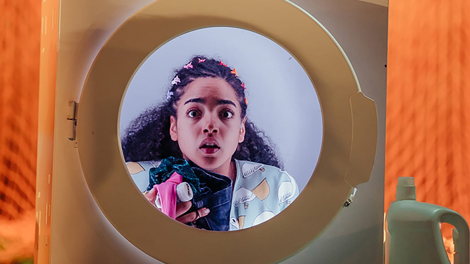 A girl using a washing machine as a time machine