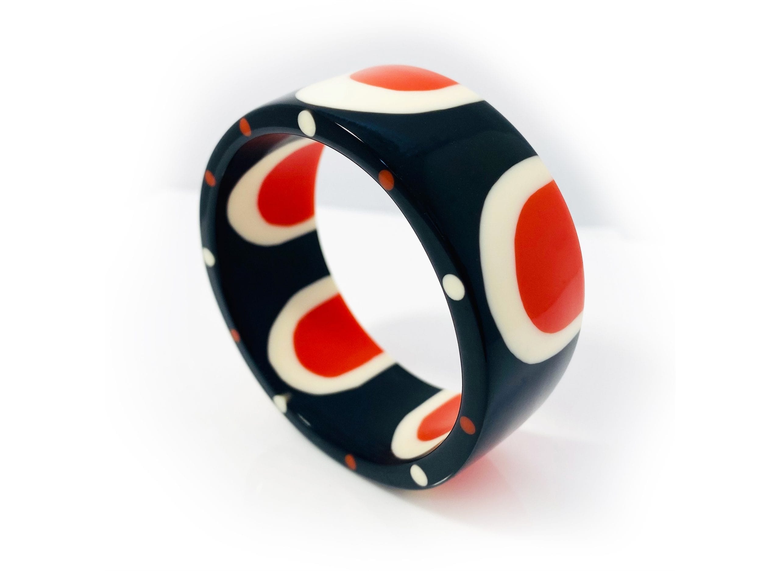 A black, orange and white ring on a white background