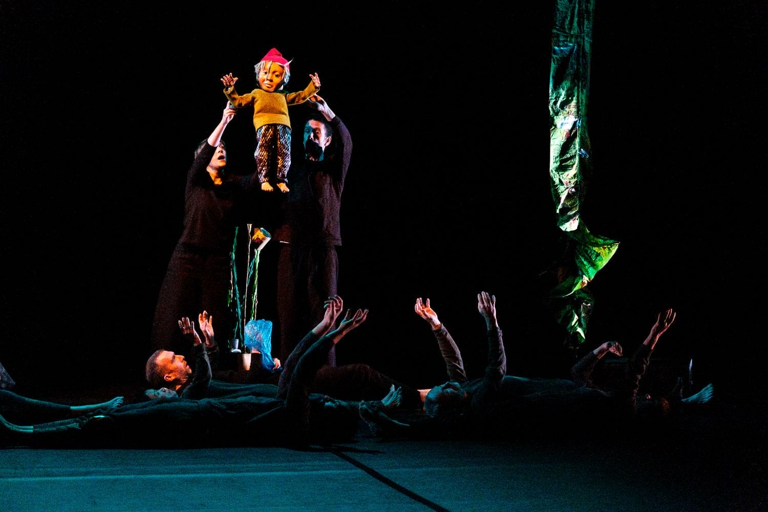 ensemble holding up watersprite sculpture