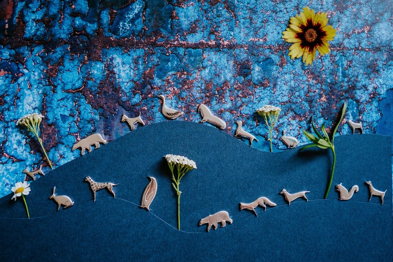 a selection of wooden animal themed jewellery