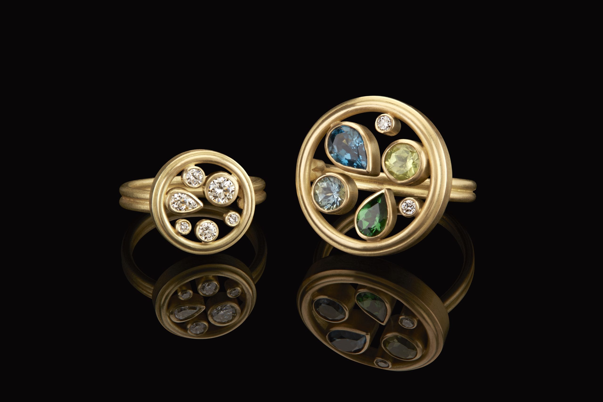 two gold rings with decorative stones