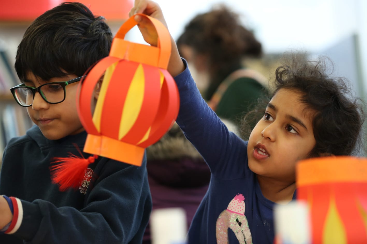 Children making Chinese paper lanterns