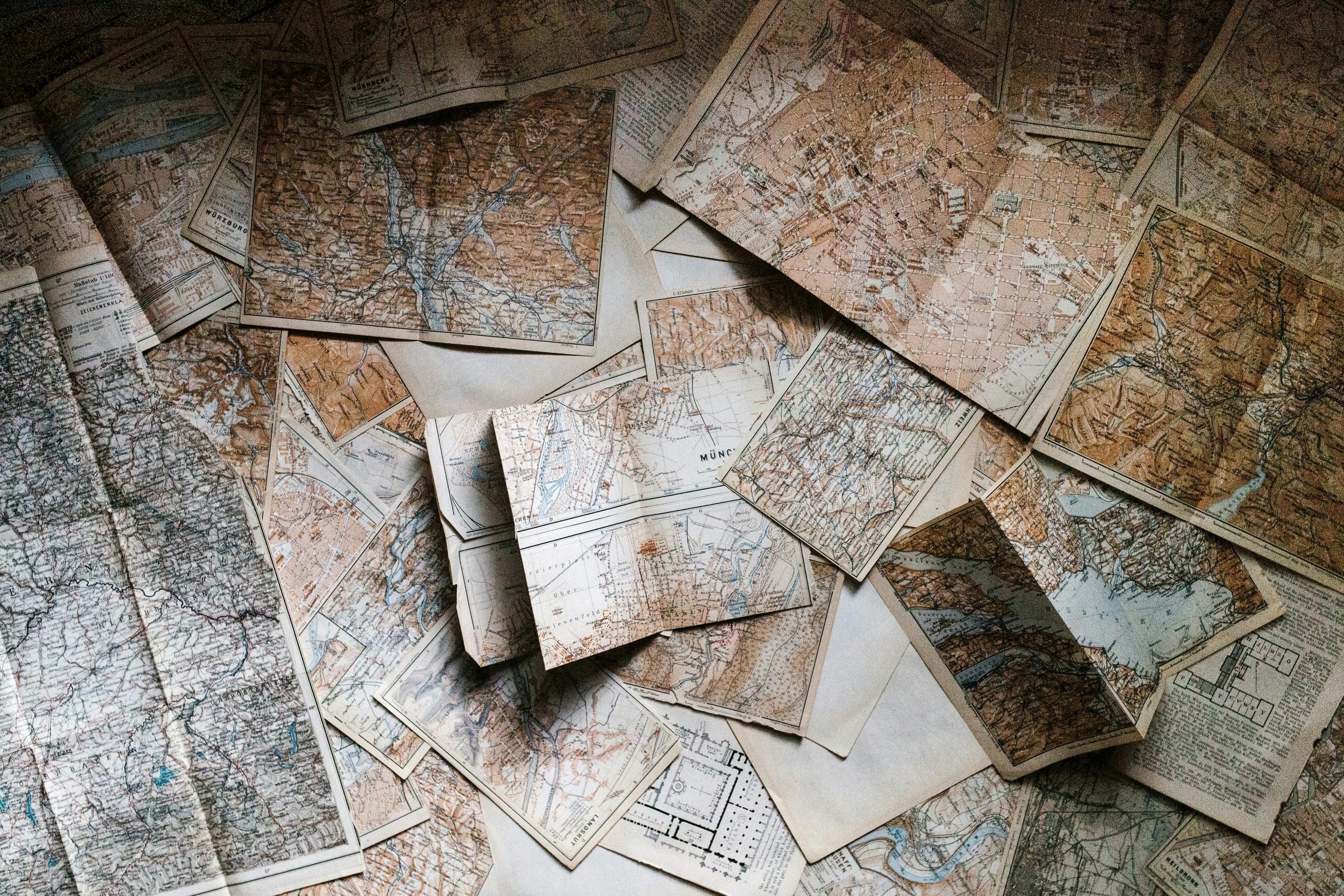 A pile of various aged maps