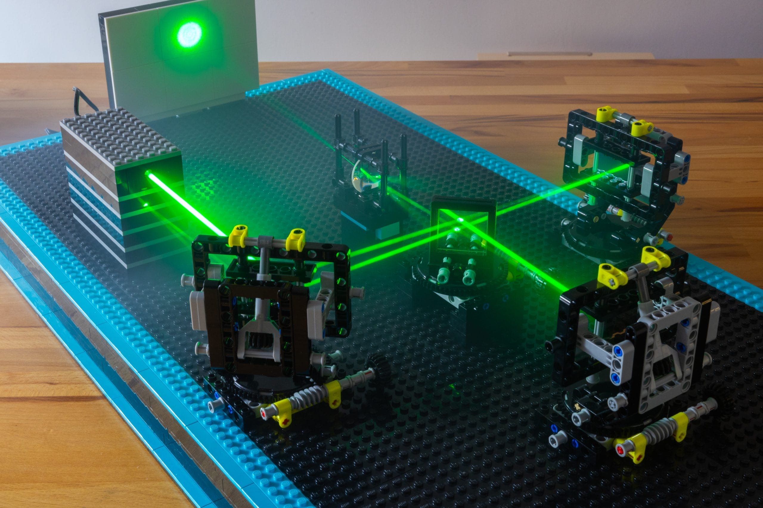 A lego set-up with light beams deflecting off different lego structures.