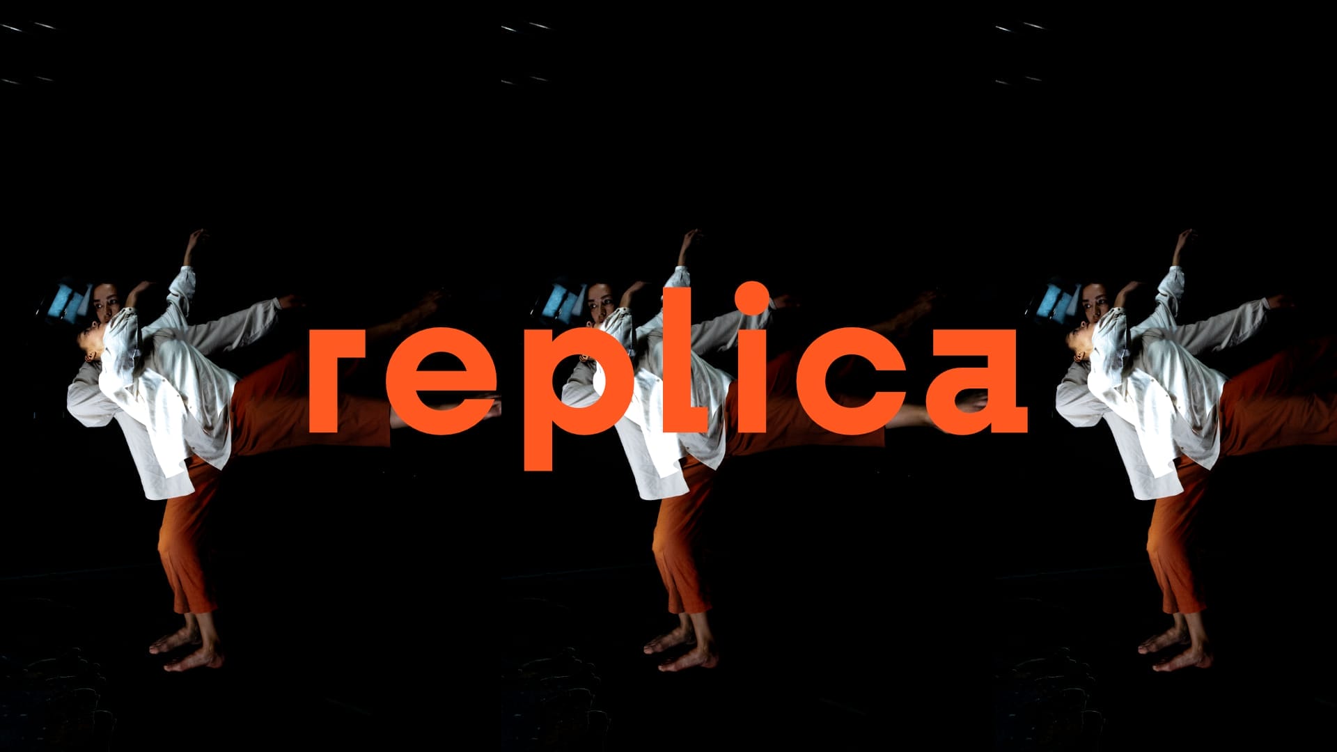 A repeated photograph of two people dancing, one stood in front of the other, both wearing orange trousers and white shirts with a black backdrop and the word 'replica' sat centrally in orange.