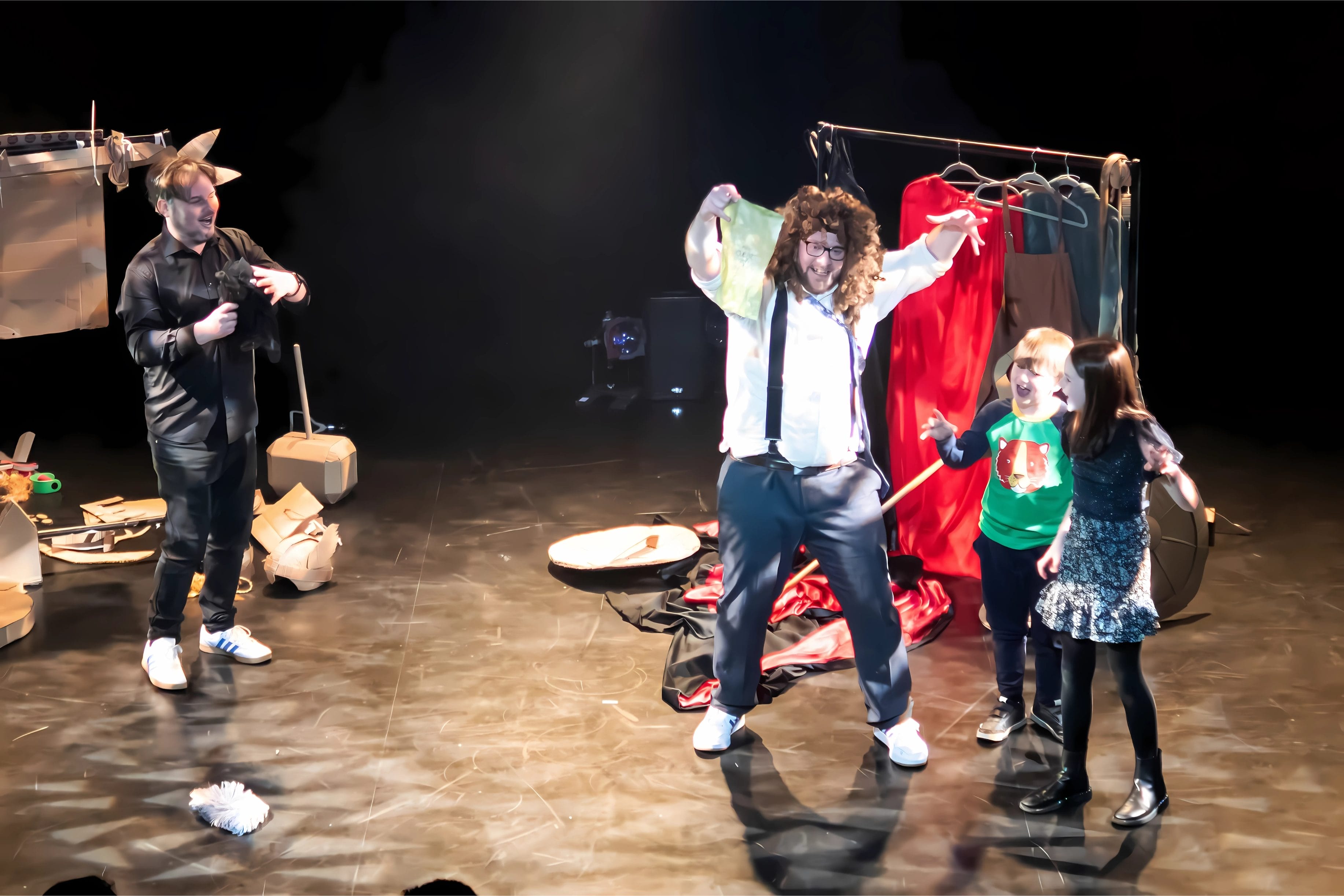 Children partake in a workshop on stage.