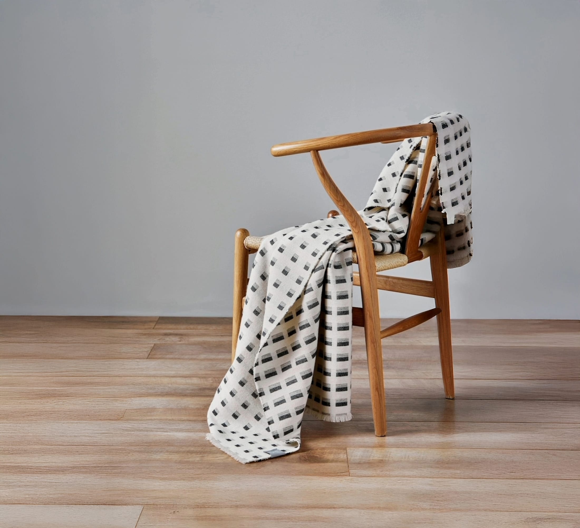 White and brown patterned throw blanket.