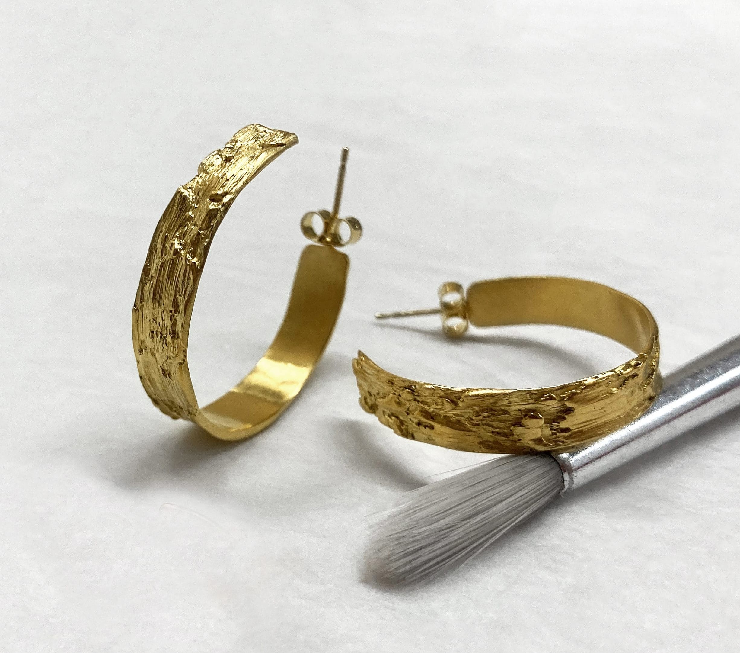Gold, engraved thick hoop earrings