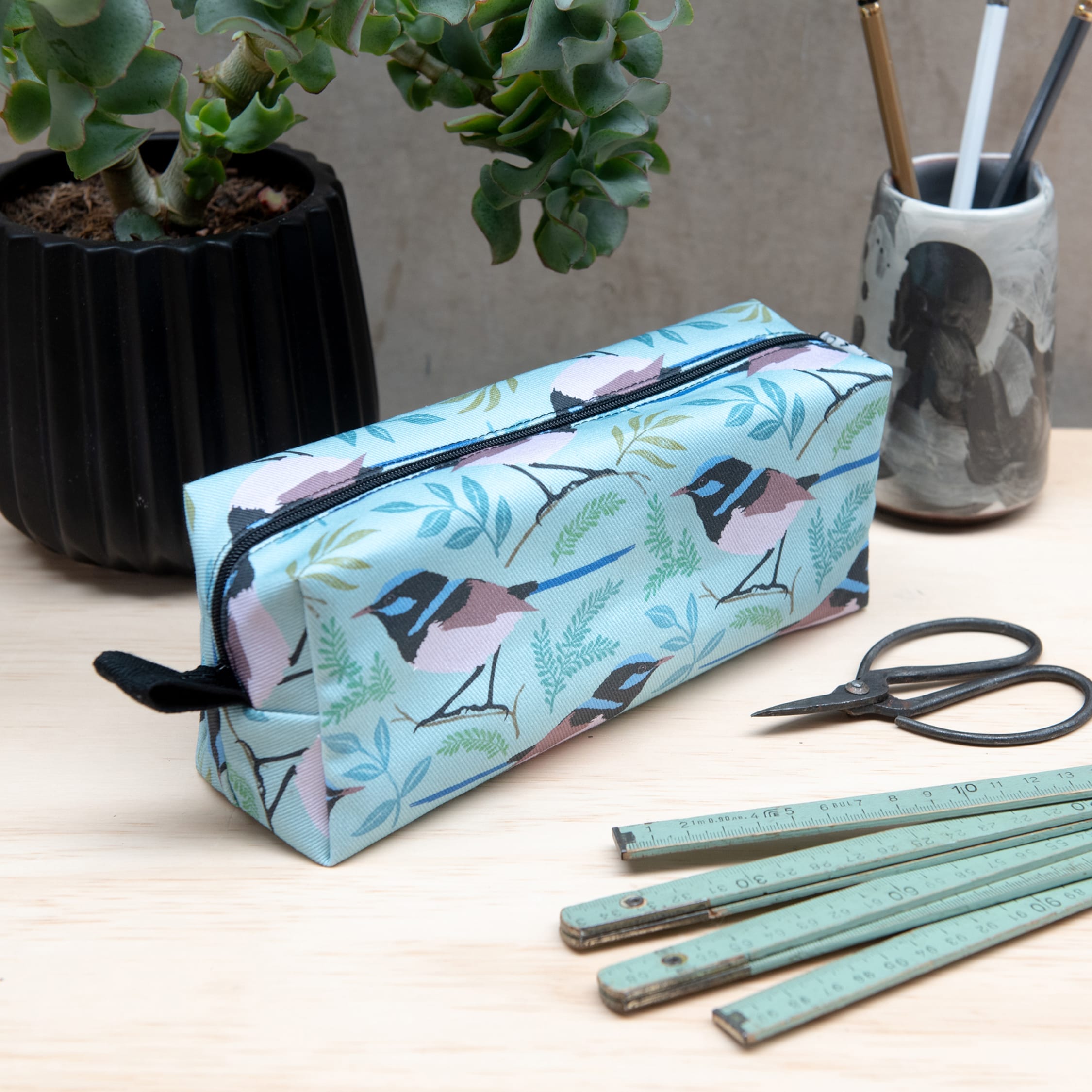 Pencil case made with fabric covered in a bird design