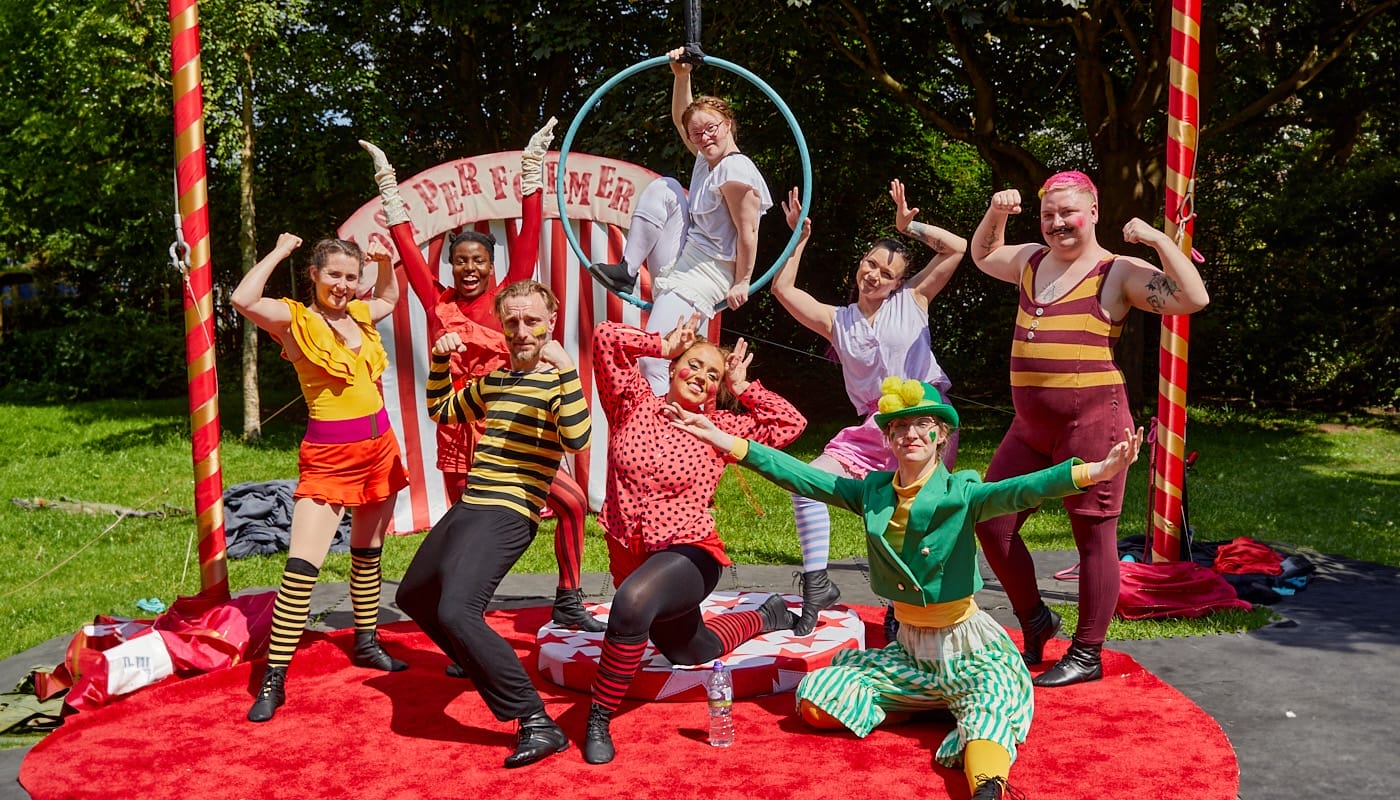A group of circus performers present themselves