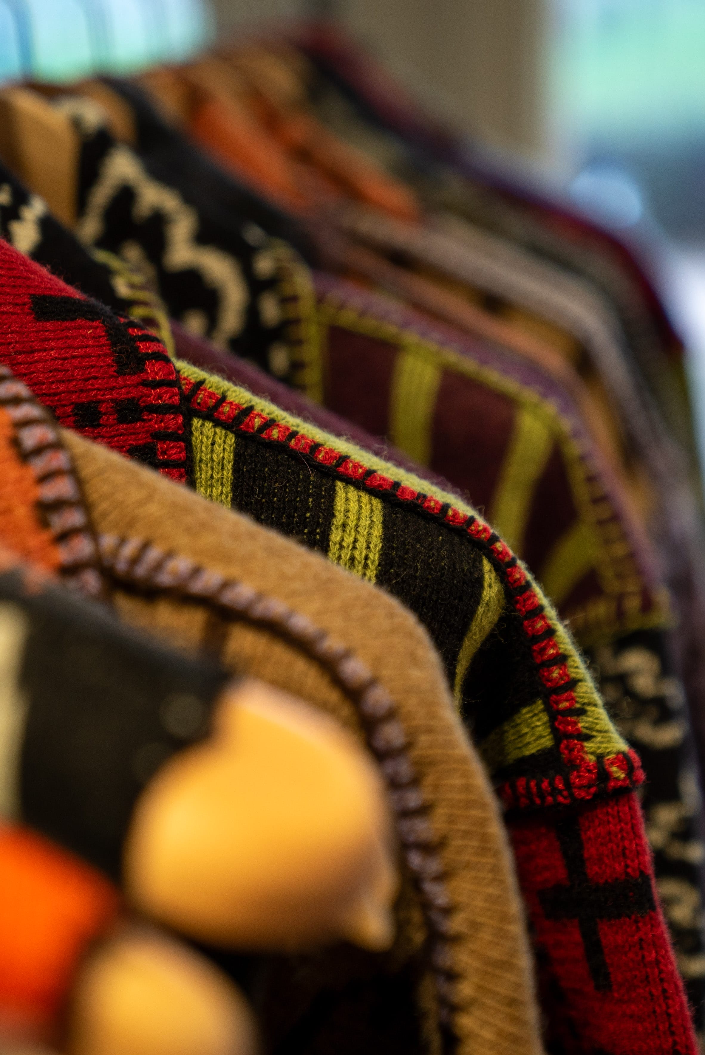 A rail of knitted jackets
