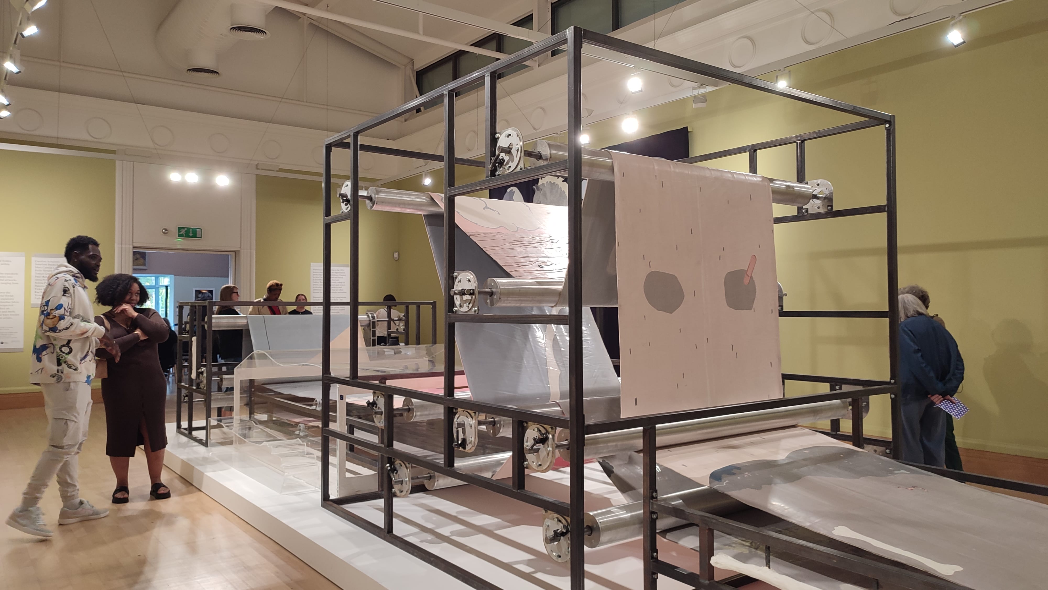 A closer look at Slacker, the industrial printing press combined with a human parts tapestry