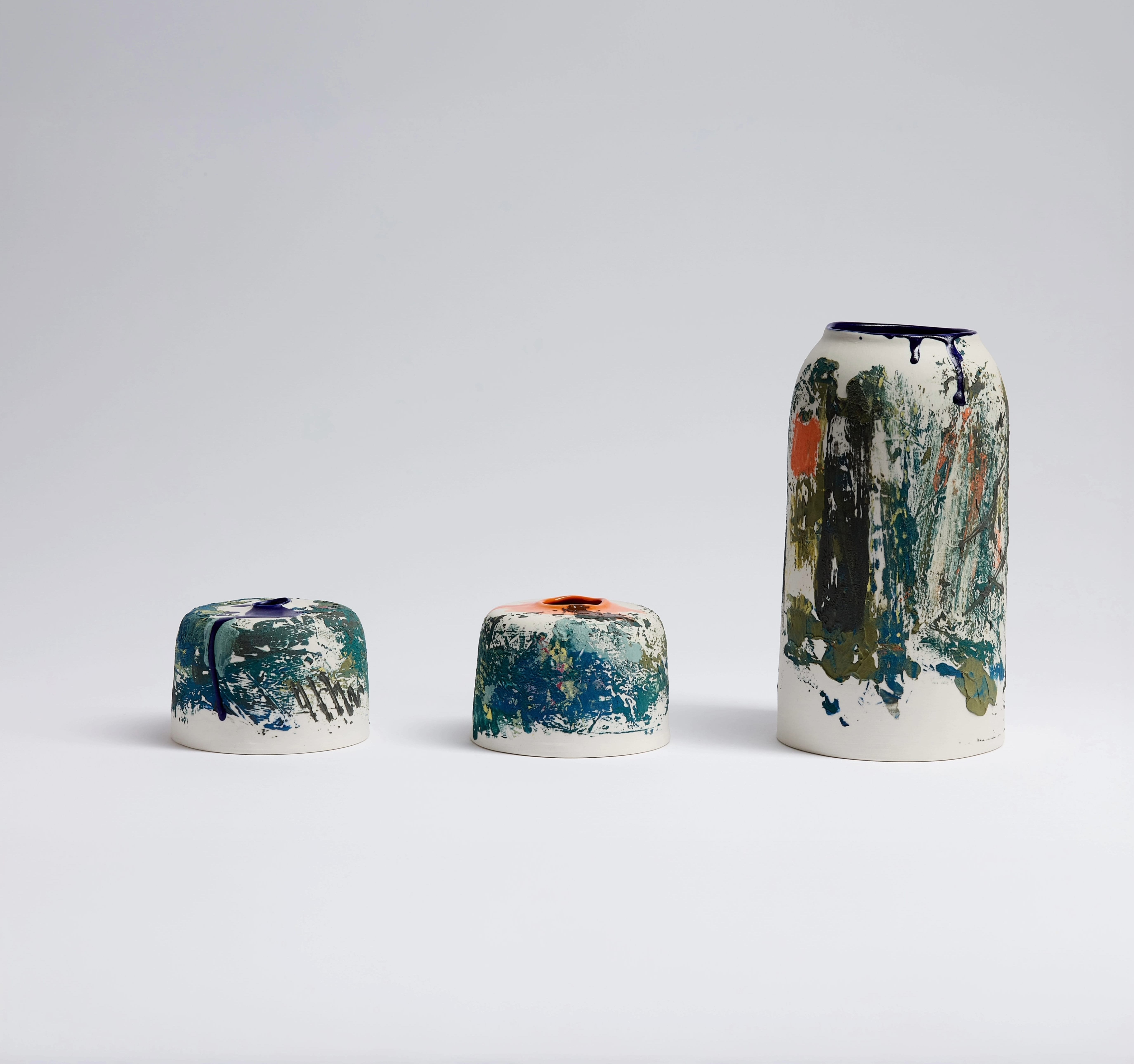 Varying sizes of vases, with abstract painting details.