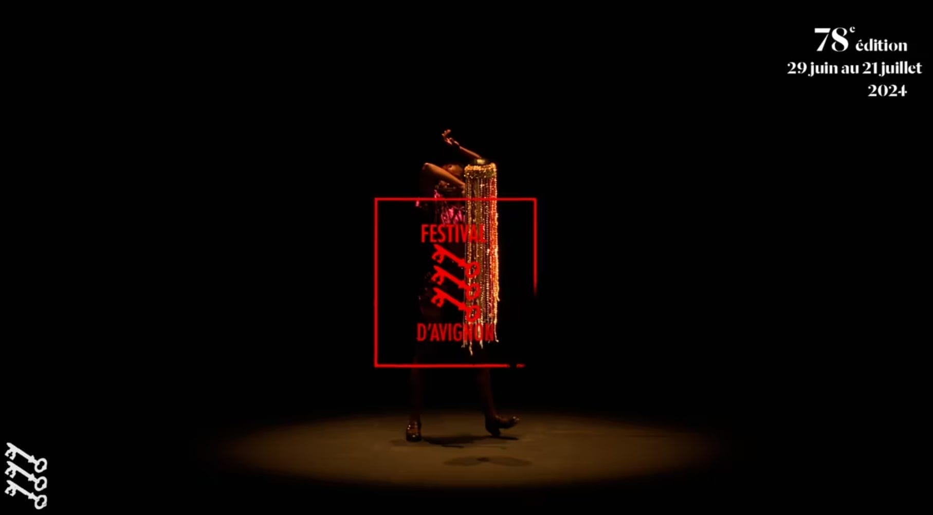 a still from a trailer video with a play button on top