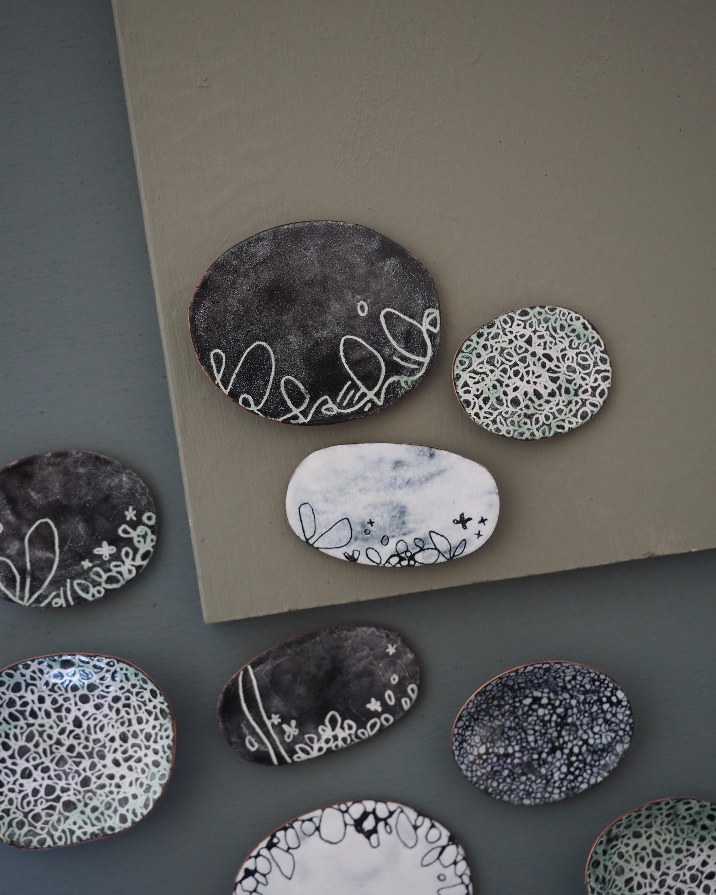 Small circular pieces in monochrome.