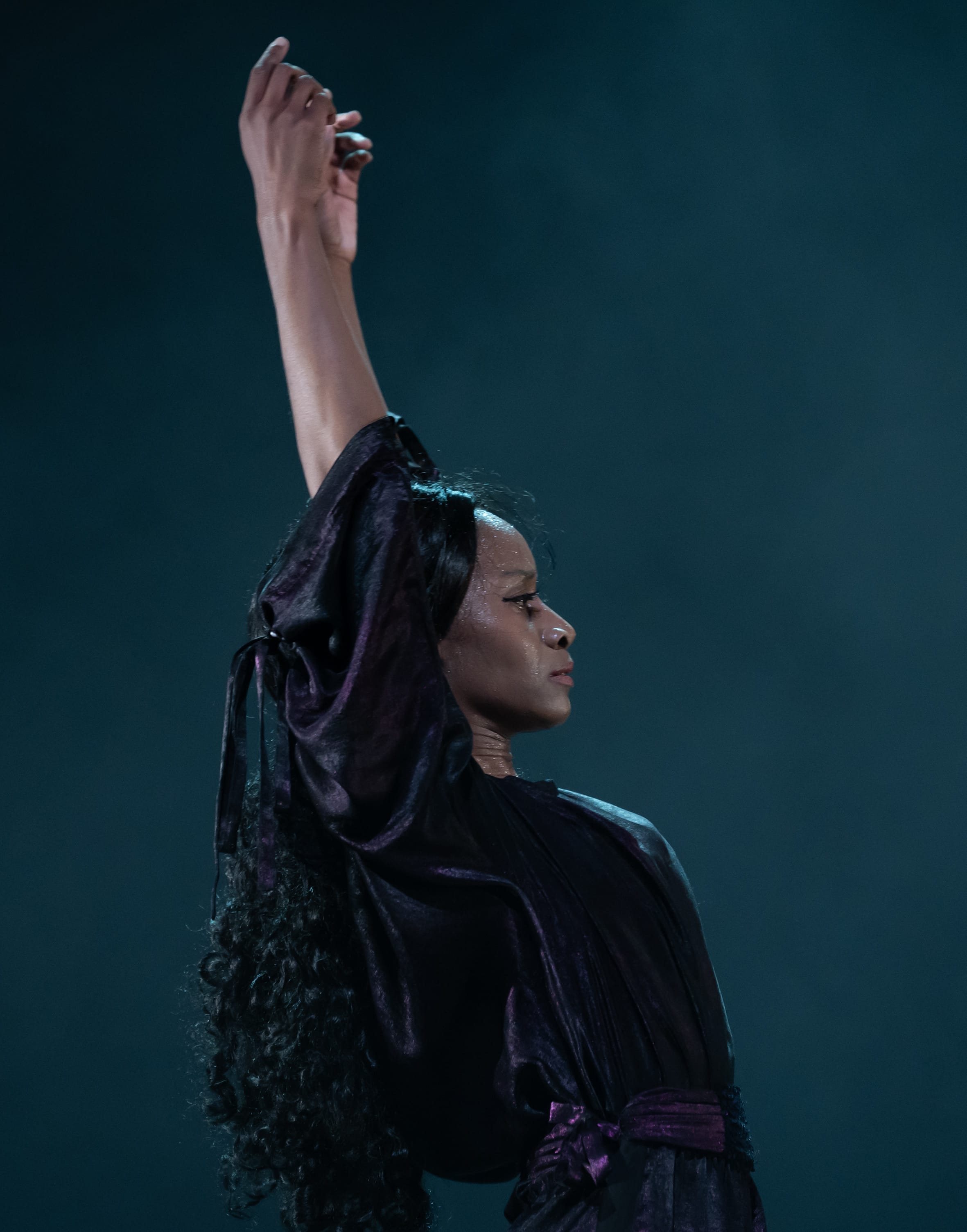 A woman performs flamenco on stage