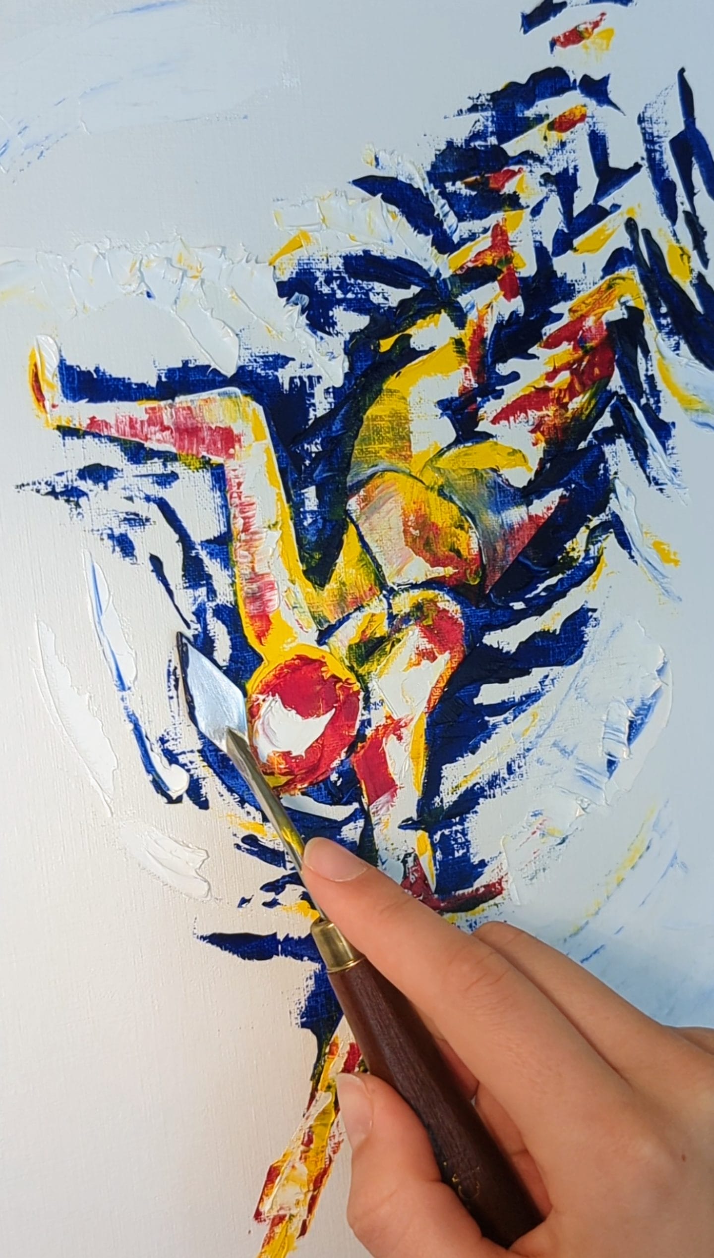 a photo of a palette-knife ona half-done painting of a swimmer