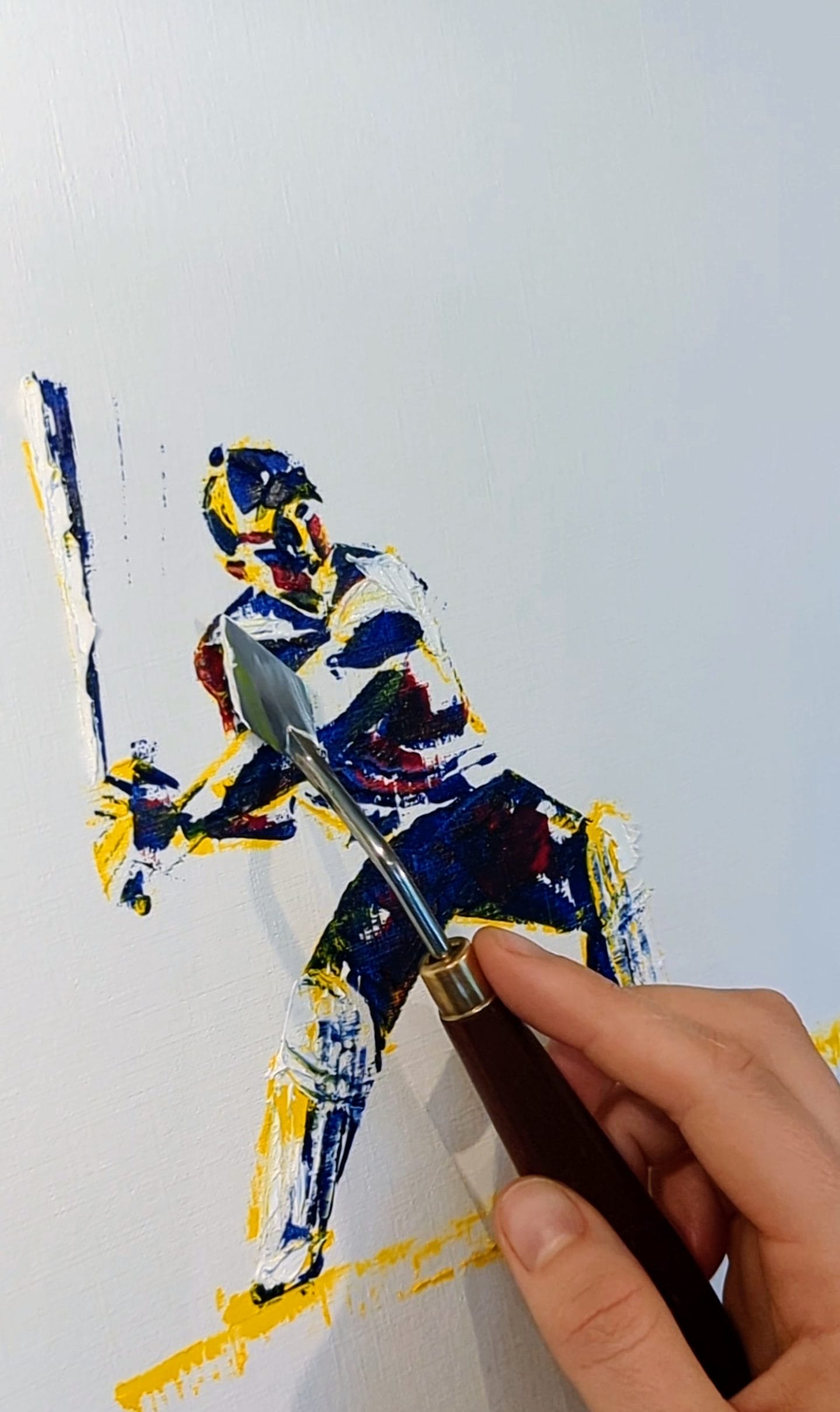 a photo of a palette-knife ona half-done painting of a cricketer