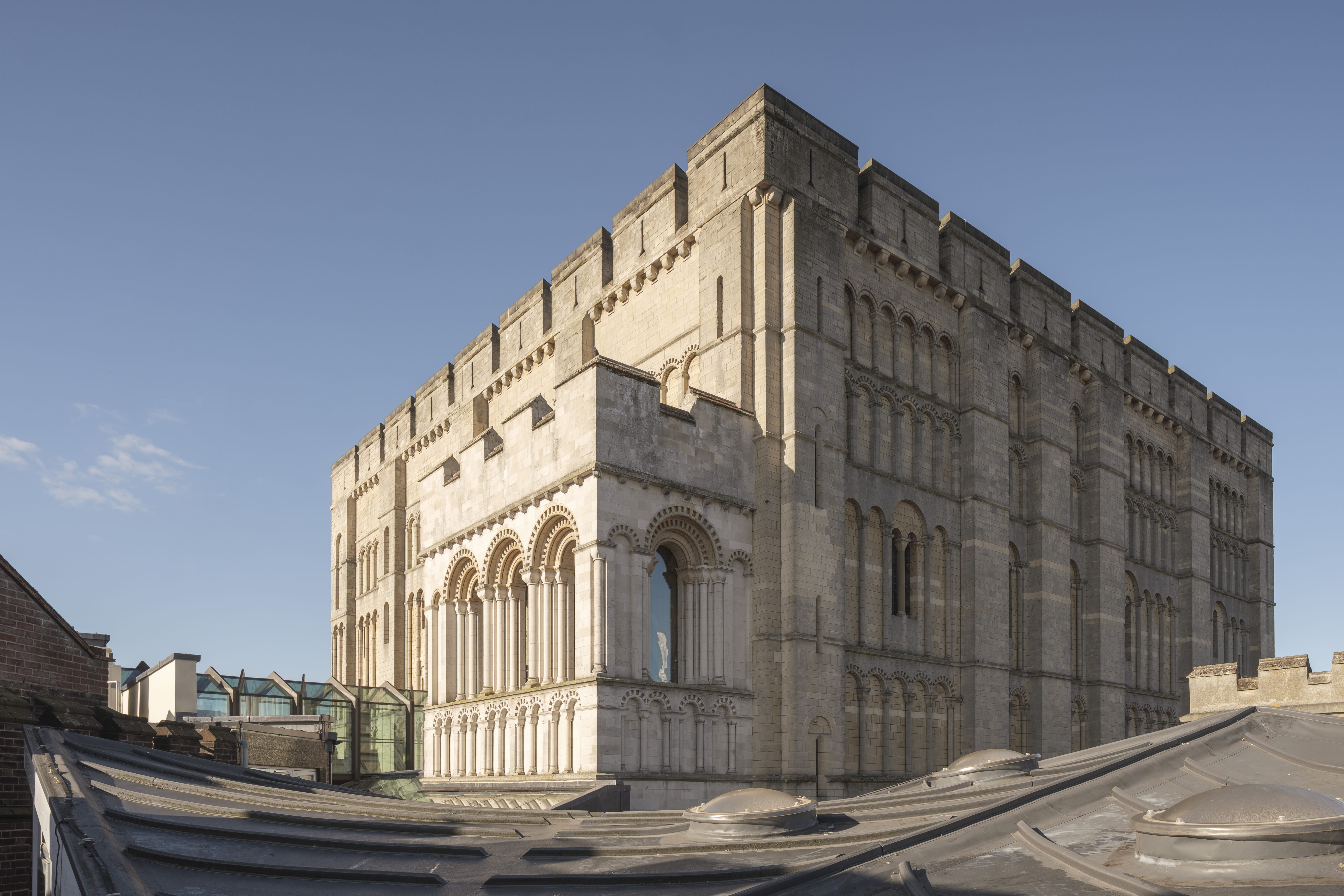 Norwich Castle, a large stone building with a turreted roof line.