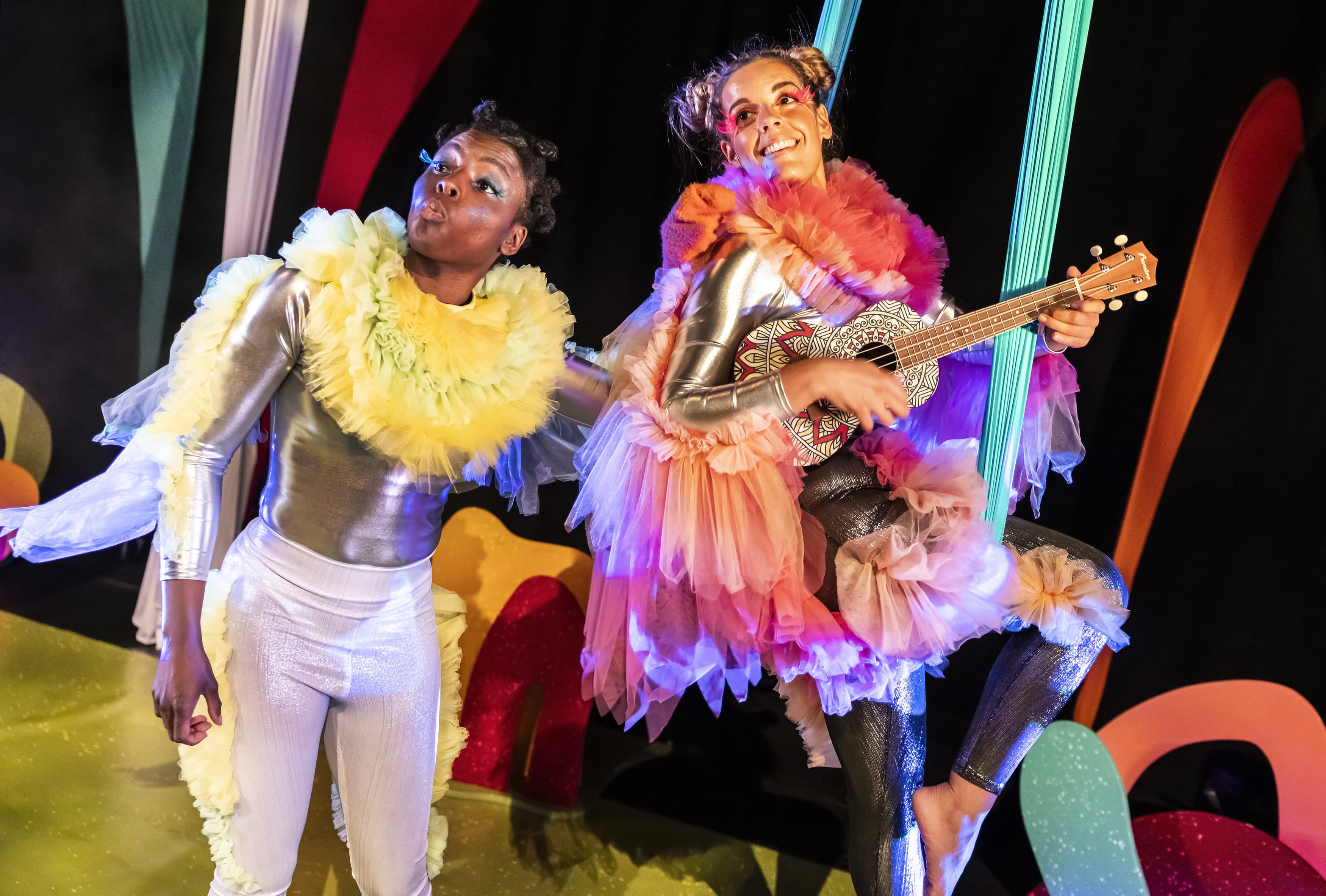 Two women, dressed in metallic leotards, and fabric wings, perform in Take Flight.
